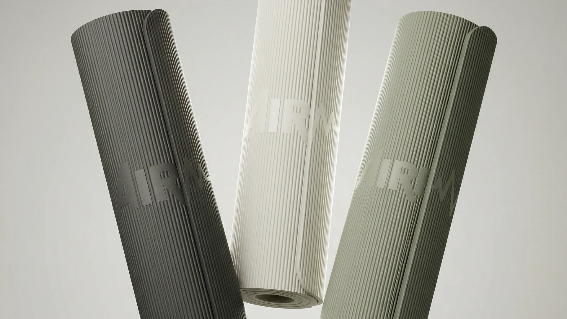 Three AIREX exercise mats displayed against a light background.