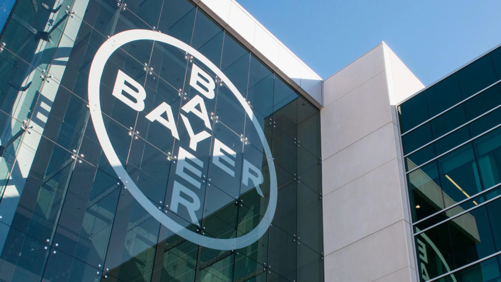 Bayer logo on a glass building facade