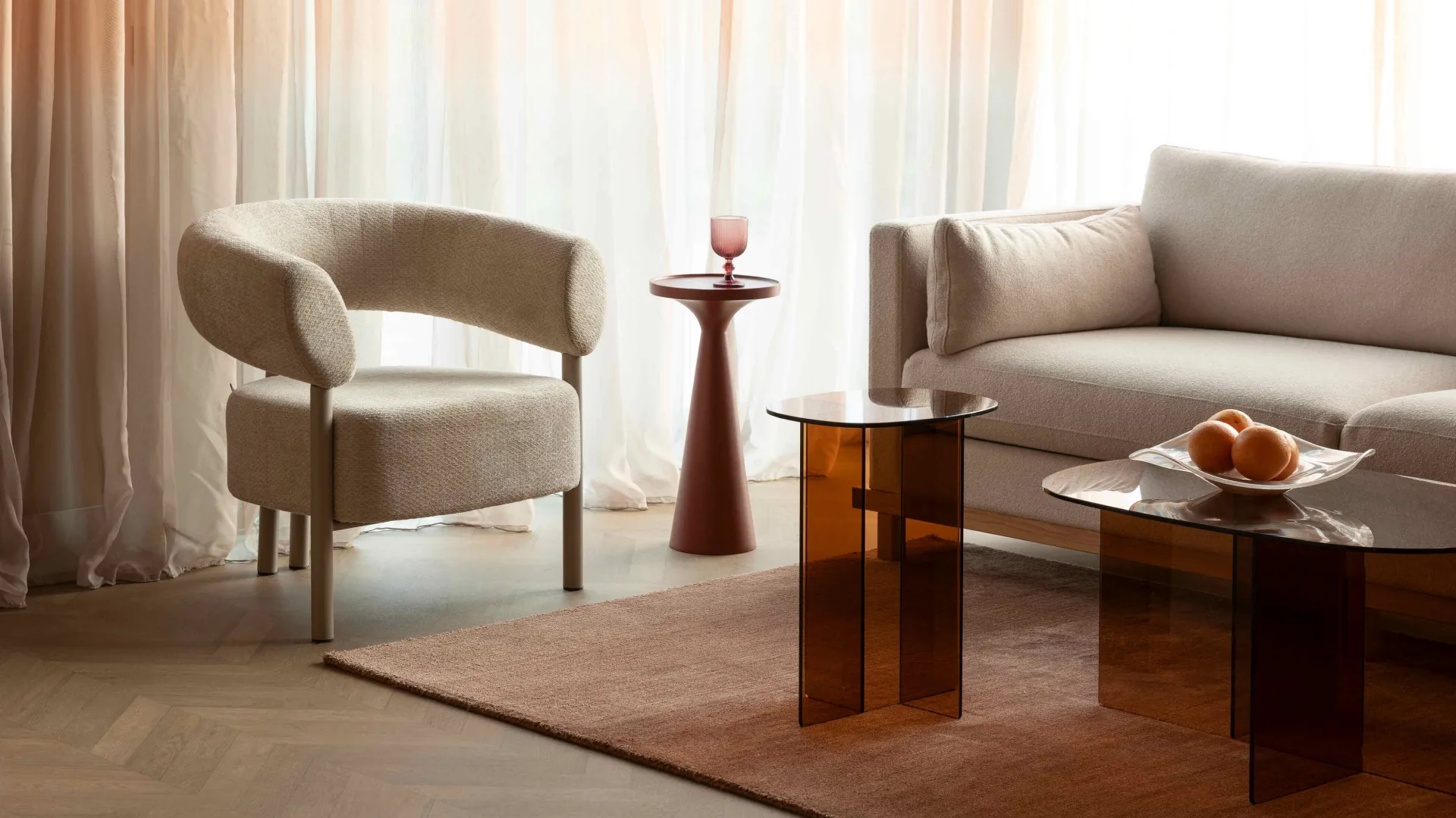Furniture room with upholstered chair, sofa and tables