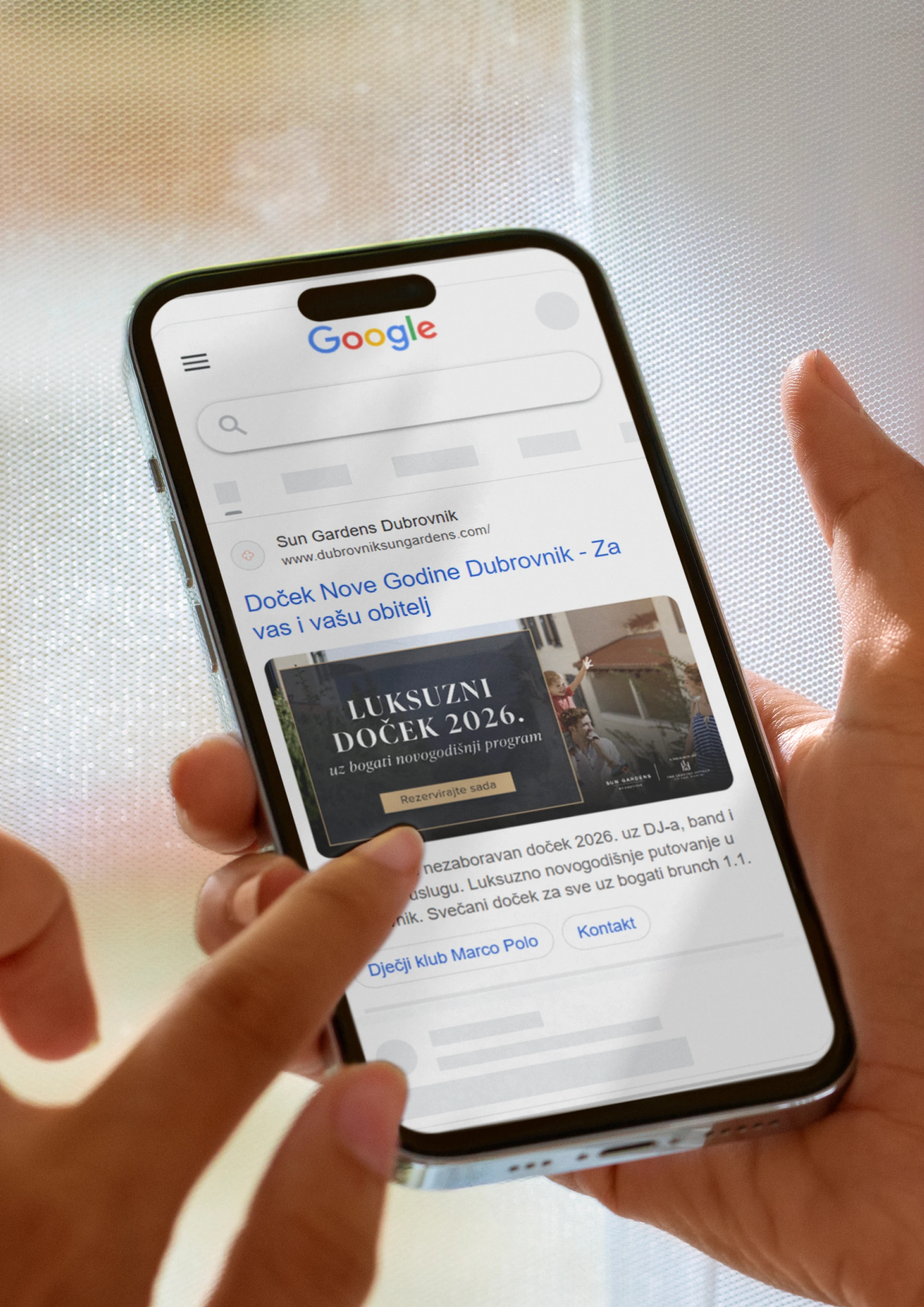 Hand holding a phone displaying a Google result for Sun Gardens Dubrovnik.