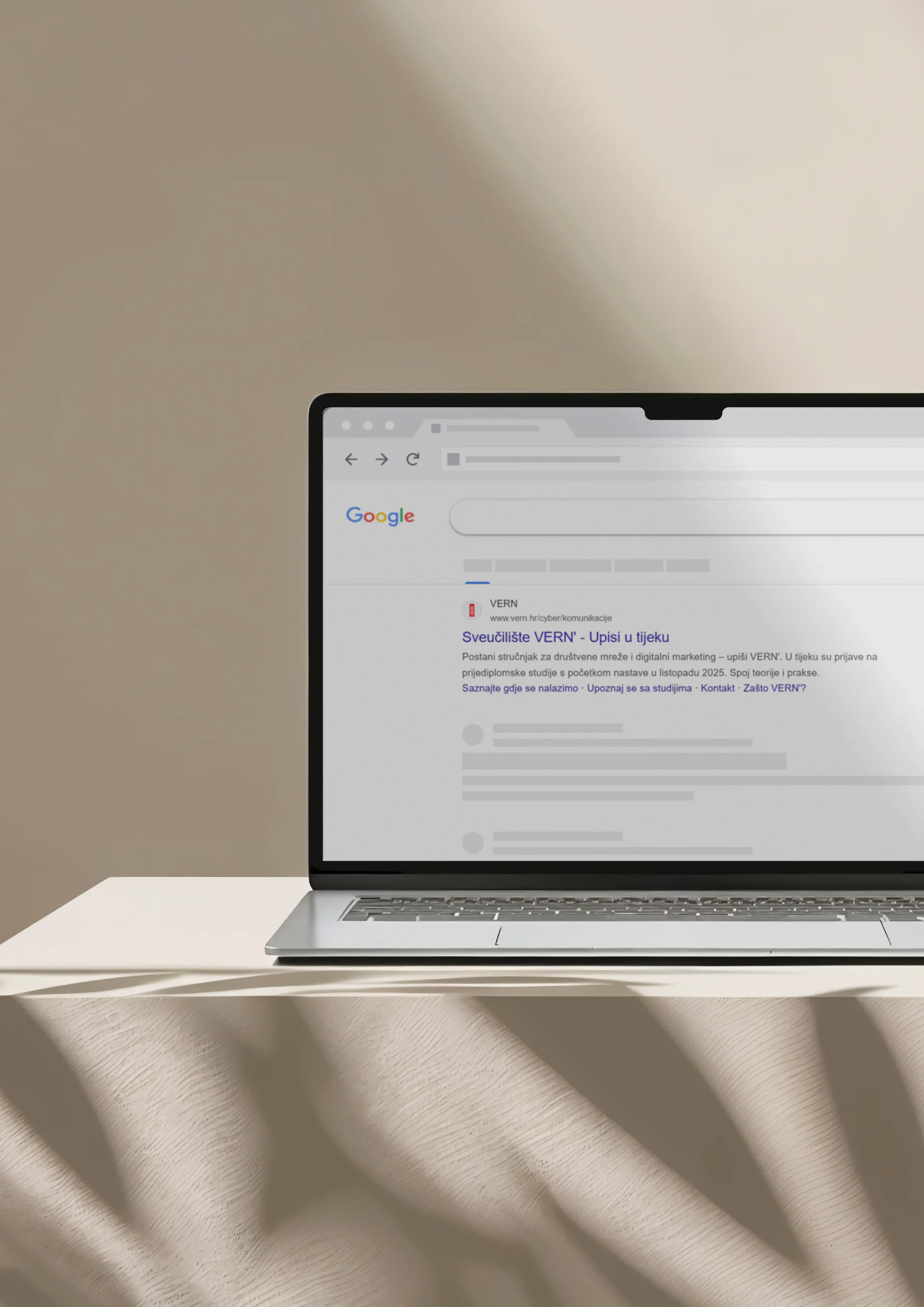 VERN university search advertisement shown on a laptop